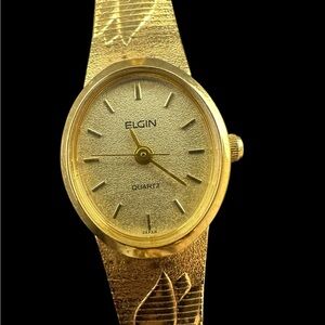 Elgin women’s Watch. Gold tone with floral pattern on strap
